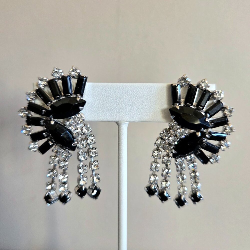 Vintage Warner large dangling clip on black and clear rhinestones earrings.